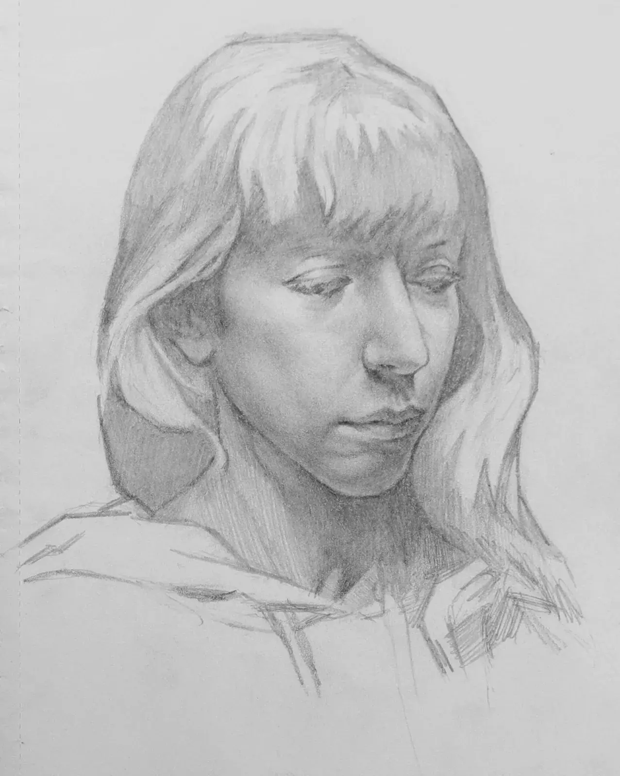 Pencil portrait of a long-haired person looking down with soft graphite shading.