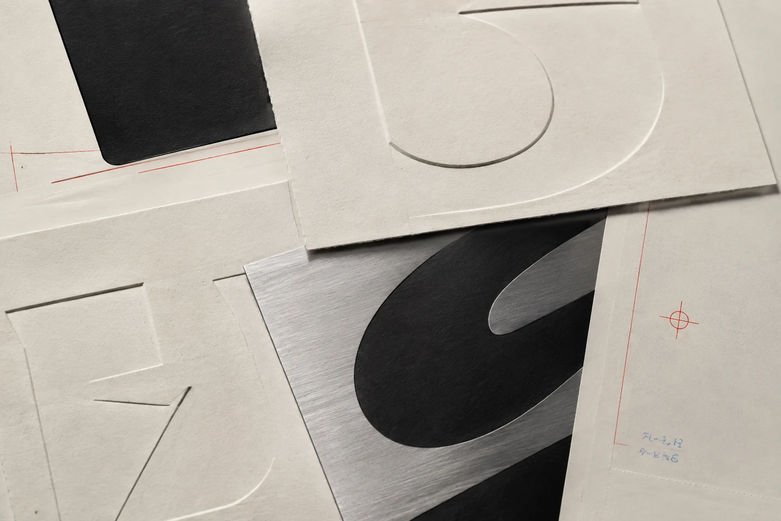 Abstract letterform fragments exploring material, spacing, and counterforms.